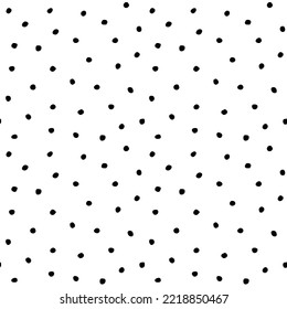 Hand drawn different sized chaotic speckles, flecks, stains or dots seamless pattern. Unusual polka dot black on white abstract monochrome background. Uneven specks, spots, blobs, splashes texture.