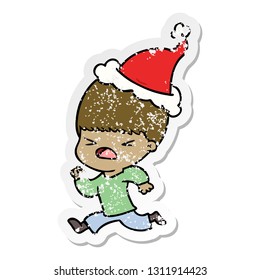 hand drawn distressed sticker cartoon of a stressed man wearing santa hat