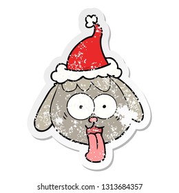 hand drawn distressed sticker cartoon of a dog face panting wearing santa hat