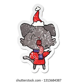 hand drawn distressed sticker cartoon of a panting dog wearing santa hat