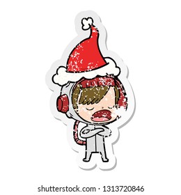 hand drawn distressed sticker cartoon of a astronaut woman explaining wearing santa hat