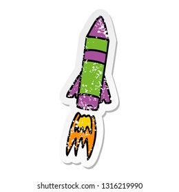 hand drawn distressed sticker cartoon doodle of a space rocket 