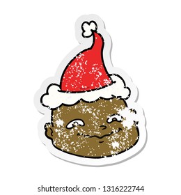 hand drawn distressed sticker cartoon of a bald man wearing santa hat