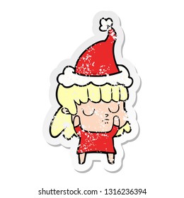 hand drawn distressed sticker cartoon of a indifferent woman wearing santa hat