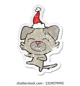 hand drawn distressed sticker cartoon of a dog kicking wearing santa hat