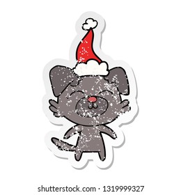 hand drawn distressed sticker cartoon of a dog wearing santa hat