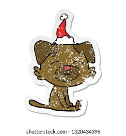 hand drawn distressed sticker cartoon of a dog wearing santa hat