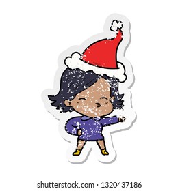 hand drawn distressed sticker cartoon of a woman pointing wearing santa hat