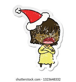 hand drawn distressed sticker cartoon of a woman talking loudly wearing santa hat