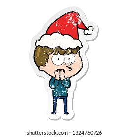 hand drawn distressed sticker cartoon of a curious boy wearing santa hat