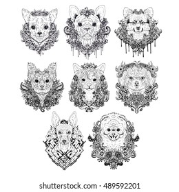 Hand drawn dog faces. Set of graphic black and white pets with flowers. Collection of animal heads. Dog breeds. Tattoo art. Doodle line abstract design. Vector illustration.