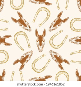 
Hand drawn donkey head and horseshoe seamless pattern. Vintage vector design.