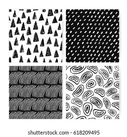 Hand drawn doodle abstract seamless pattern set. Collection of black and white backgrounds with different freehand shapes.