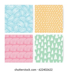 Hand drawn doodle abstract seamless pattern set. Collection of colorful backgrounds with different freehand shapes.