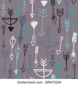 Hand drawn doodle arrows and bows seamless pattern. Colored vector illustration for wallpaper design, covers, fabric