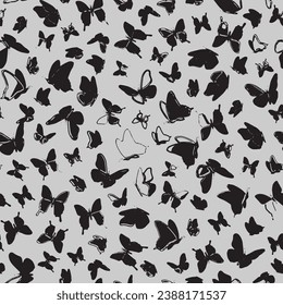 Hand drawn doodle butterflies seamless pattern. Childish print for wallpaper,kids fabric,nursery interior. Black and white vector background. 