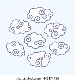 Hand drawn doodle clouds on blue dotted background. Art vector illustration