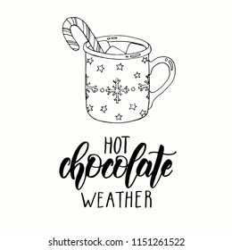 Hand drawn doodle cup of hot chocolate with marshmallow and candy in a sketch style. Hot chocolate weather - lettering calligraphy phrase 