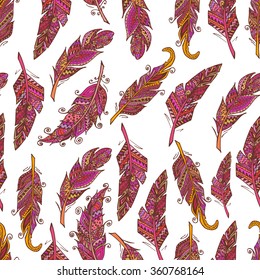 Hand drawn doodle feathers seamless pattern. Vector background.