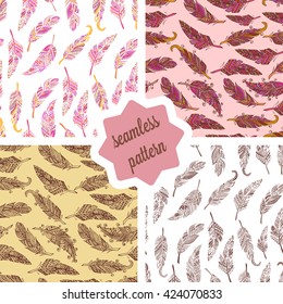 Hand drawn doodle feathers seamless patterns set. Vector background.
