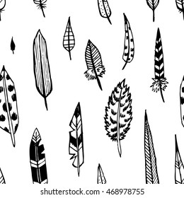 Hand drawn doodle feathers. Seamless pattern.