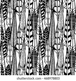 Hand drawn doodle feathers. Seamless pattern.