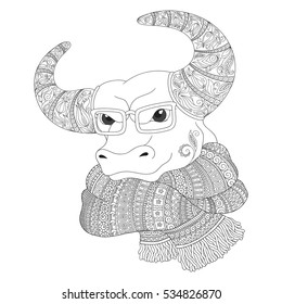 Hand drawn doodle outline cow head decorated with ornaments. Bull  in a scarf and glasses. Freehand sketch for adult anti stress coloring book page with doodle and zentangle elements.