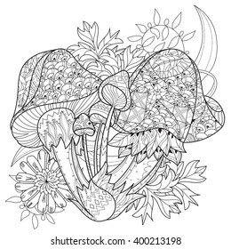 Hand drawn doodle outline magic mushrooms  decorated with floral ornaments.Vector zentangle illustration.Floral ornament.Sketch for tattoo, poster, children or adult coloring pages.Boho style.
