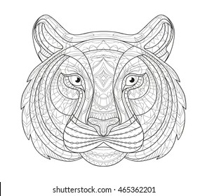 Hand drawn doodle outline tiger illustration. Decorative in African indian totem Ethnic tribal aztec design. Sketch for adult antistress coloring page.