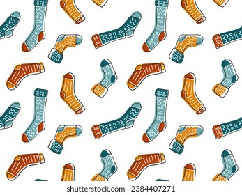 Hand drawn Doodle pair of knitted Socks different colors. Seamless Pattern with funny Warm clothing Accessories