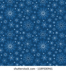 Hand drawn doodle seamless pattern. White snowflakes on a dark background. For fabric, textile, wrapping paper, card, invitation, wallpaper, web design.