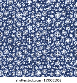Hand drawn doodle seamless pattern. White snowflakes on a dark background. For fabric, textile, wrapping paper, card, invitation, wallpaper, web design. 