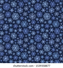 Hand drawn doodle seamless pattern. White snowflakes on a dark background. For fabric, textile, wrapping paper, card, invitation, wallpaper, web design. 