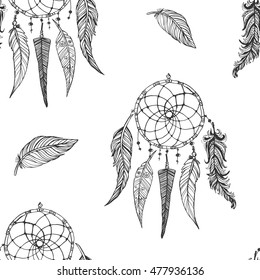 Hand drawn doodle seamless pattern. Indian dream catchers, feathers. 