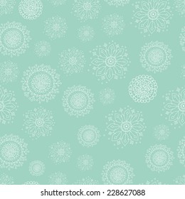 Hand Drawn Doodle Snowflakes Seamless Pattern on Turquoise Background