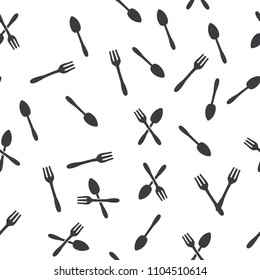 Hand drawn doodle spoon, knife and fork seamless pattern.