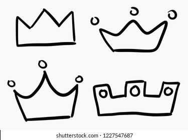 Hand drawn doodle style vector set of crowns black icons isolated on white background