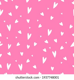 Hand drawn doodle tiny white hearts on barbie pink background seamless pattern. Valentine`s day graphics for postcards, ads, wrapping paper

