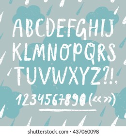 Hand drawn doodle vector ABC letters set on decorative grungy background with clouds. Grungy textured comic font and figures for your design.