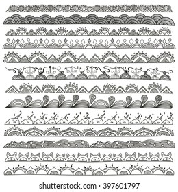 Hand drawn doodle vector dividers and design elements