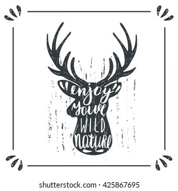 Hand drawn doodle wild deer silhouette with lettering quote enjoy your wild nature. Card, postcard, background with deer