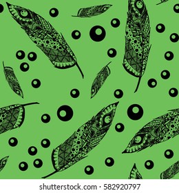 Hand drawn doodle zentangle feather isolated from background. Black and green illustration.