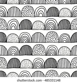 Hand drawn doodles seamless repeating pattern in black and white.