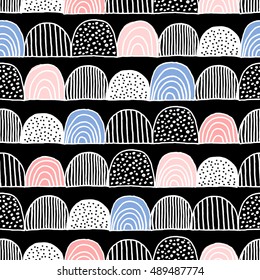 Hand drawn doodles seamless repeating pattern in black, blue, pink and white.