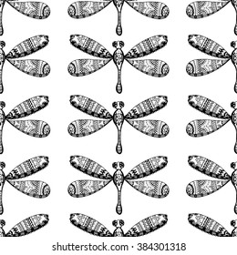 Hand drawn dragonfly ink doodle seamless pattern. Sketched insects on white background. Black and white monochrome fly flora print.
