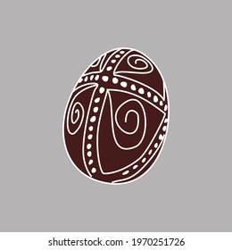 Hand drawn Easter egg with white lines on a brown background. Ethnic traditional motif ukrainian national pattern swirls