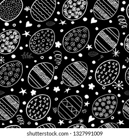 Hand drawn Easter seamless pattern. Black pattern with white ornamental eggs. Easter holiday background. Vector illustration.