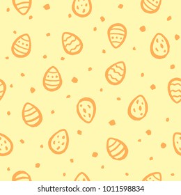 Hand drawn Easter seamless vector pattern. Brush drawn easter eggs and uneven spots, blobs, flecks, specks texture. Artistic uneven edges. Endless yellow and orange background with painted eggs. 