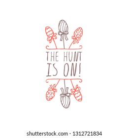 Hand drawn easter typographic element on white background. The hunt is on. Suitable for print and web