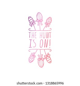 Hand drawn easter typographic element on white background. The hunt is on. Suitable for print and web